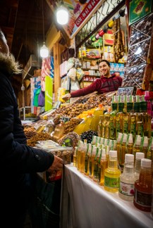 Souk man sells dates fragrant waters to L